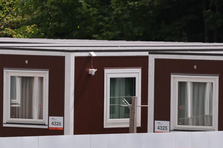 Temporary wooden container huts being used to house athletes for the 2026 Asian Games are seen at the Garden Pier in Nagoya on September 17, 2026. (Photo by DAVID GRAY / AFP)