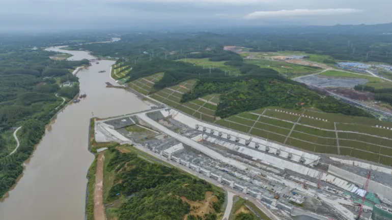 QINZHOU, CHINA - AUGUST 16 2025: Aerial view of the Qingnian Ship Lock of the 135-kilometer Pinglu Canal under construction in Qinzhou, south China's Guangxi Zhuang Autonomous Region, Saturday, Aug. 16, 2025. Designed to accommodate 5,000-ton-class vessels through three ship locks, the massive project will link the Xi River with the Beibu Gulf to create a new inlandsea waterway and reduce cargo transport costs. (Photo credit should read PENG HUAN / Feature China/Future Publishing via Getty Images)