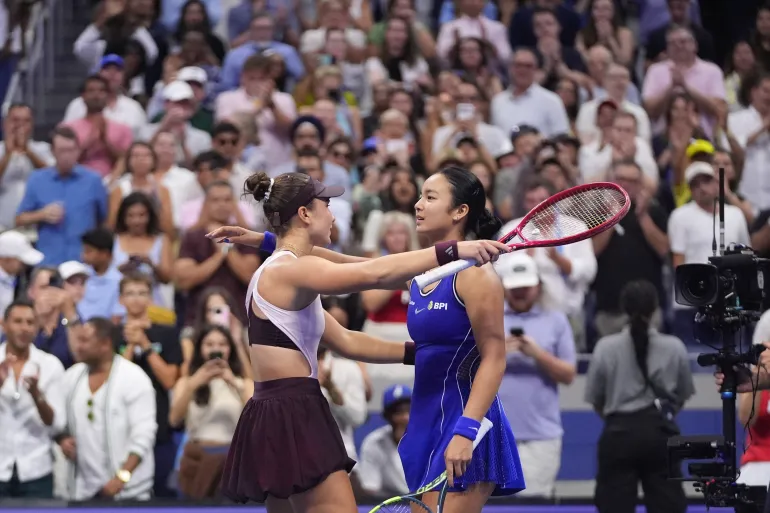 Iva Jovic, left, of the United States, embraces Alexandra Eala, of the Philippines, after Jovic won in three sets in the third round of the U.S. Open tennis championships, Saturday, Sept. 5, 2026, in New York. (AP Photo/Frank Franklin II)