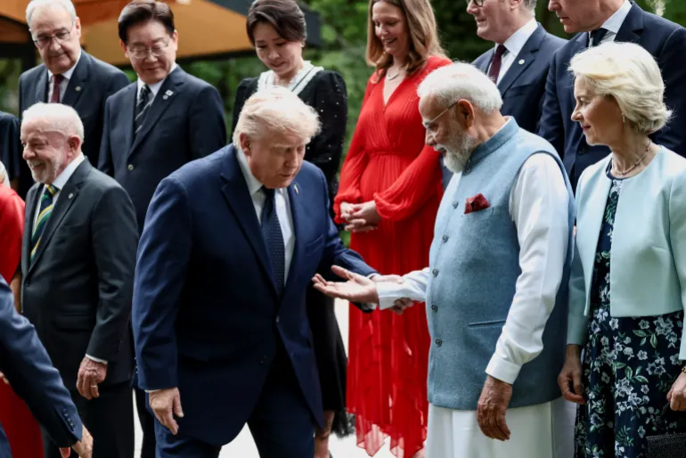 India’s Prime Minister Narendra Modi offers a hand to US President Donald Trump during a family photo before a cultural performance and concert during the G7 summit, in Evian-les-Bains, France, June 16, 2026