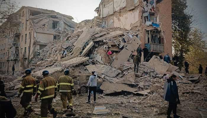 Rescuers work at a site of an apartment building damaged by a Russian missile strike, amid Russias attack on Ukraine, in the town of Pryluky, Chernihiv region, Ukraine, in this handout picture released October 7, 2026.— Reuters