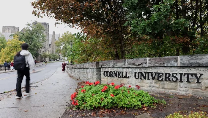 A student walks by a sign at the entrance of Cornell University in Ithaca, New York, US, October 1, 2026.— Reuters