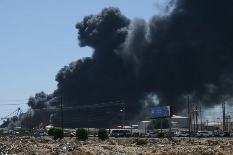 FILE - Smoke billows after drone strikes by the paramilitary Rapid Support Forces (RSF) targeted the northern port in the Red Sea city of Port Sudan, Sudan, May 6, 2025. (AP Photo, File)
